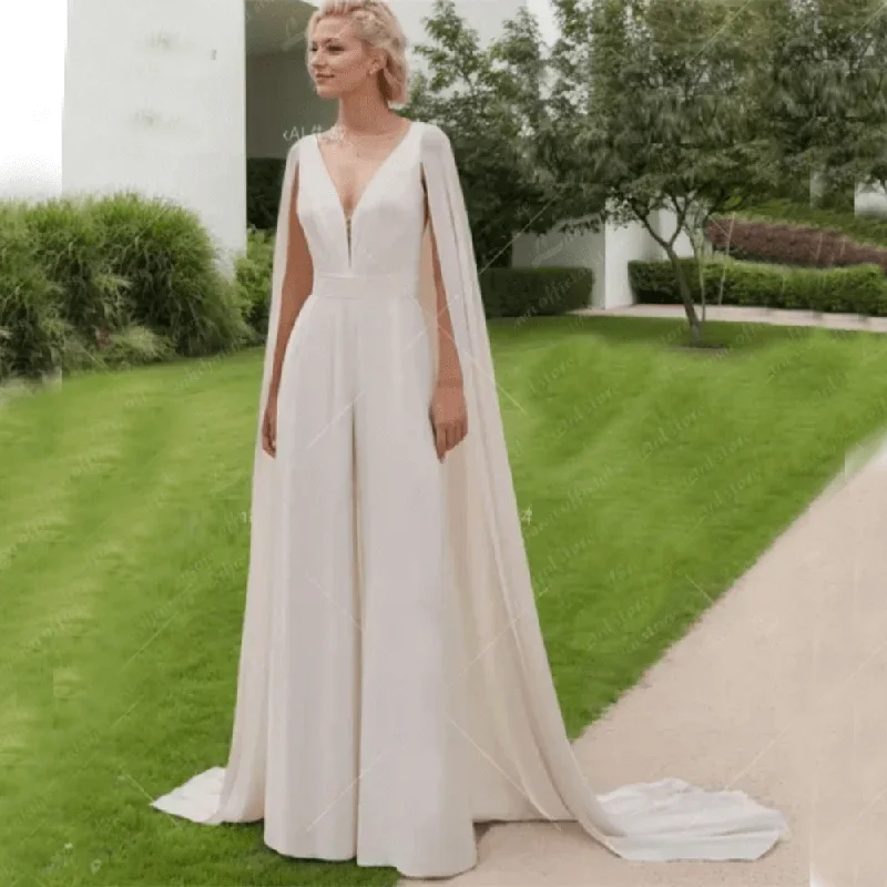 Dreamy Lace Gown Chic & Sexy Custom Ivory Wedding Jumpsuit with Cape - V-Neck Bridal Pantsuit Dreamy Lace Gown Chic & Sexy Custom Ivory Wedding Jumpsuit with Cape - V-Neck Bridal Pantsuit